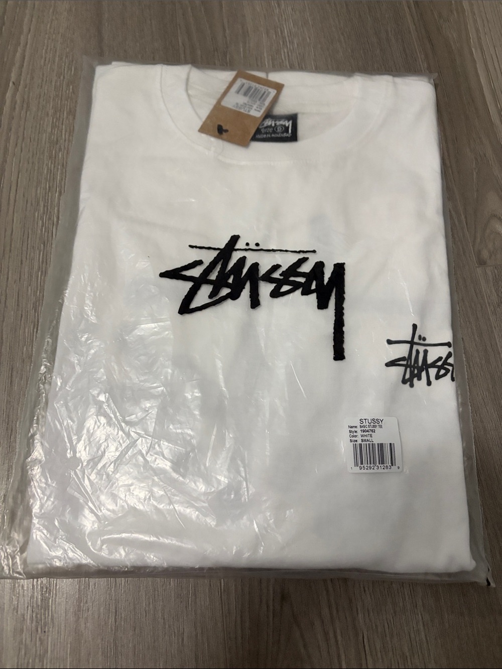 Stussy White Short Sleeve Tee with Black Script Logo